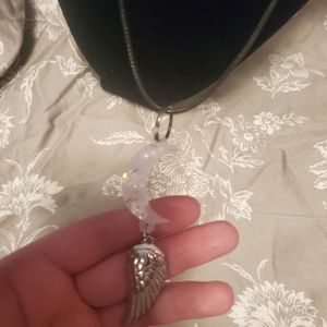 White moon with silver wing resin pendant
